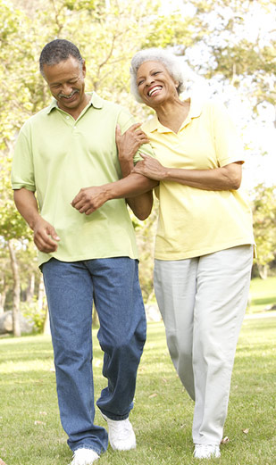 Couple walking, holding each other's arms