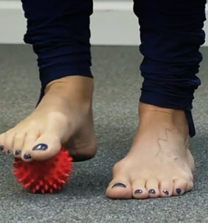 foot exercising with a ball