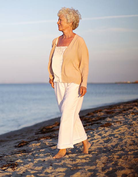 Woman walking on a beach